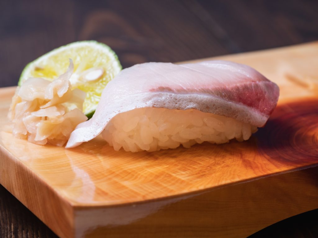 Nigiri,Sushi,On,The,Sushi,Tray.,Yellowtail,Sashimi,Topped,With